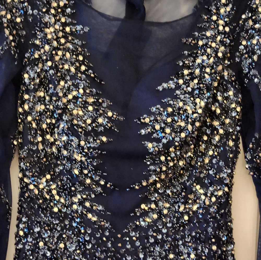 navy blue dress It is very beautiful. I used it for my son's wedding. It has a b